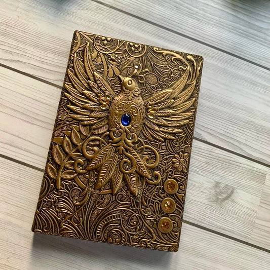 Bird with stone Premium Notebook | Diary | golden