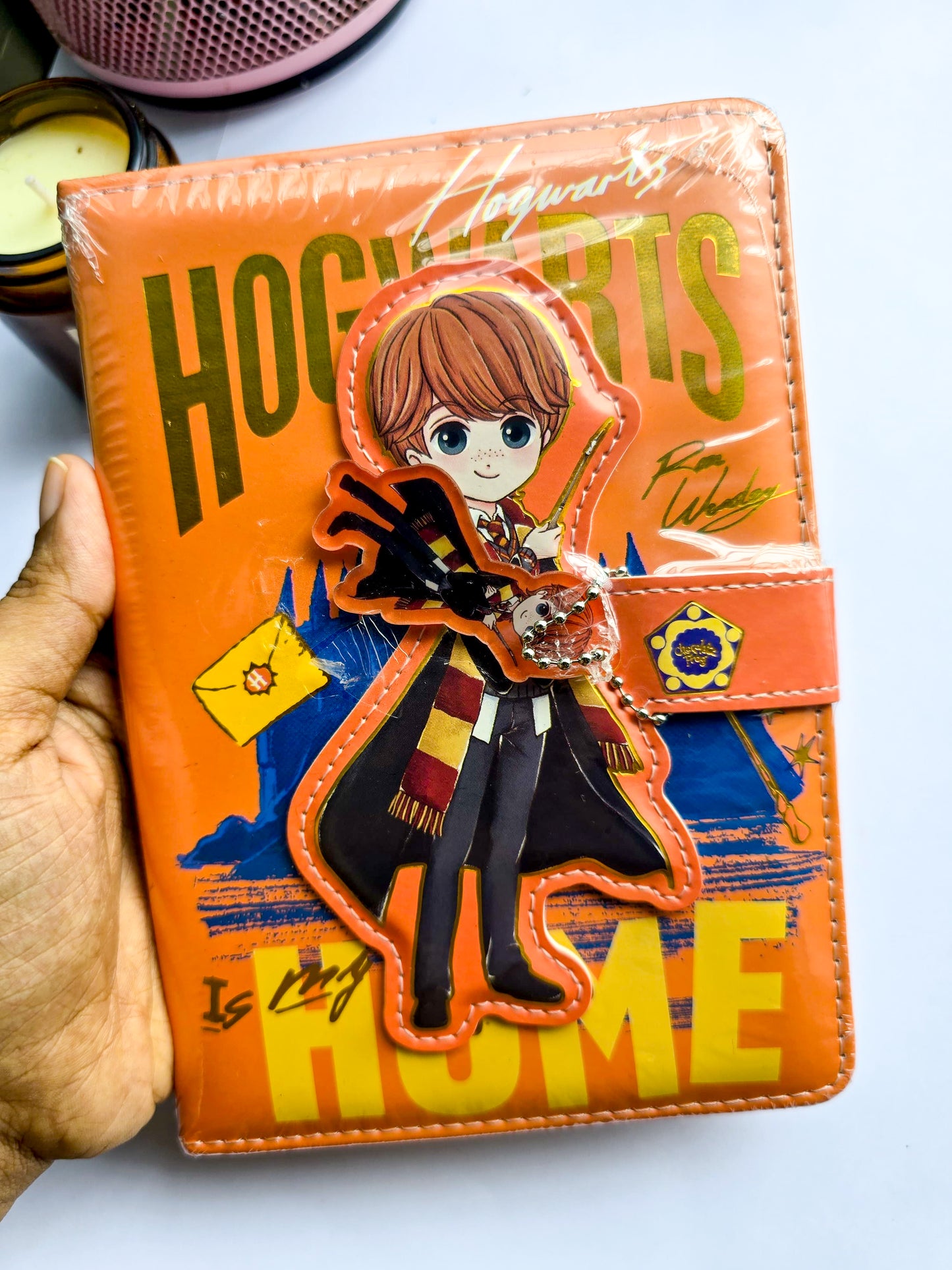 MG26610 | Harry Potter Inspired Lock Diary Featuring a Cartoon Ron Weasley Design And a Magnetic Snap Closure.