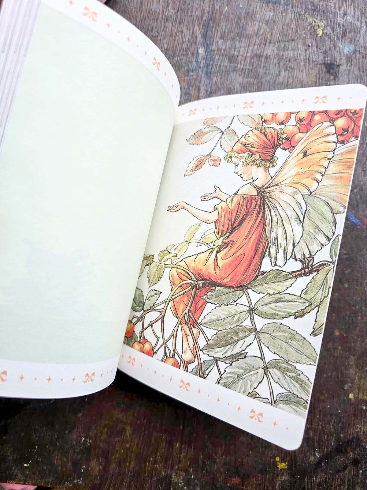 JZA5128-2557 |  Flower Fairies Notebook Features a Vibrant Illustration Titled The Sweet Pea Fairies By Cicely Mary Barker.